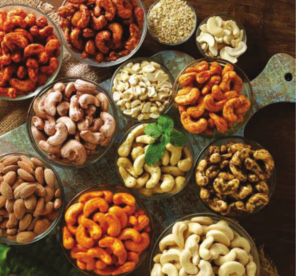 Bowls of plain, masala and flavoured cashews and almonds